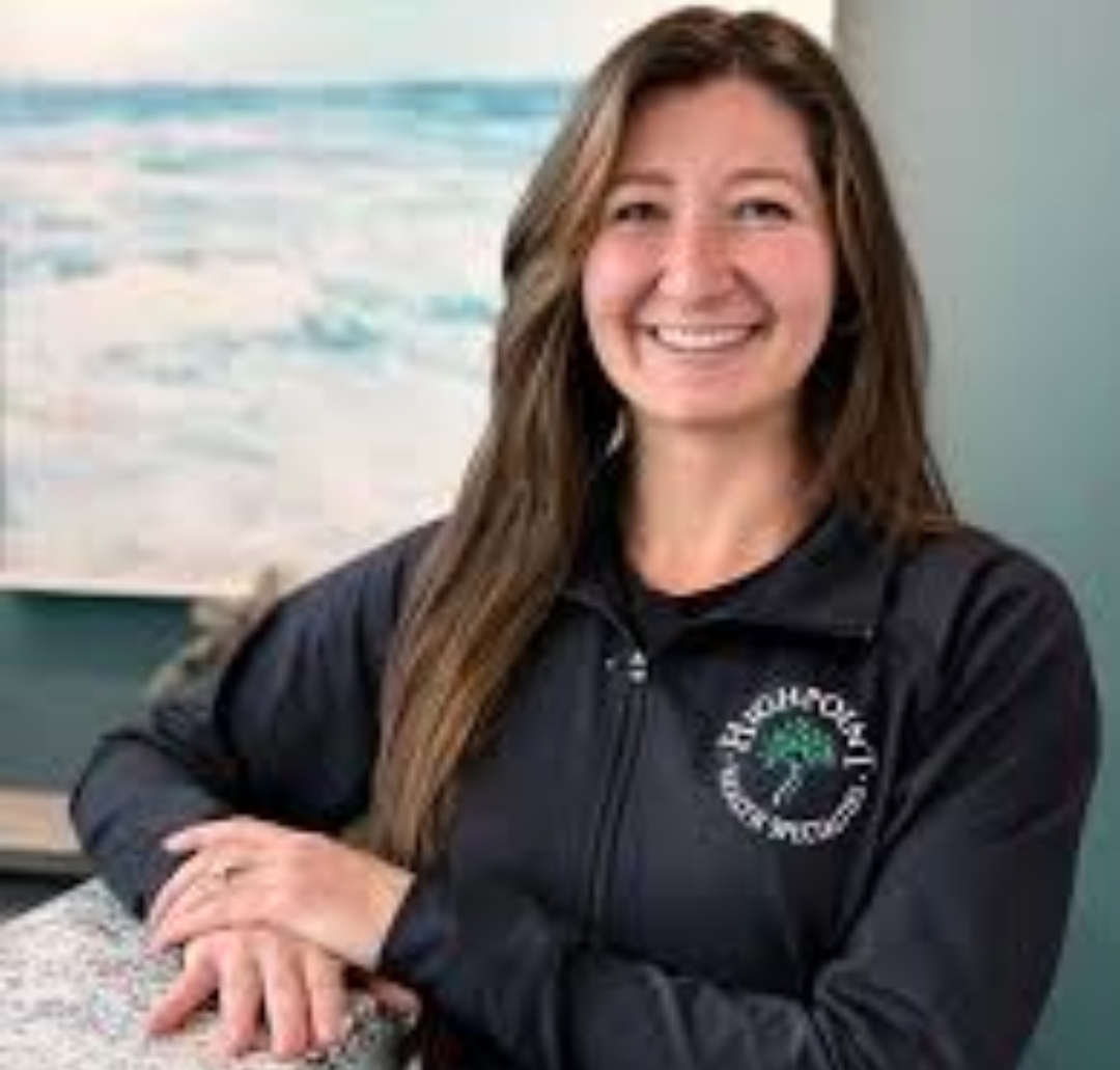 Dr. J. Leah Garlan, DC, smiling in her Highpoint Health Specialties jacket